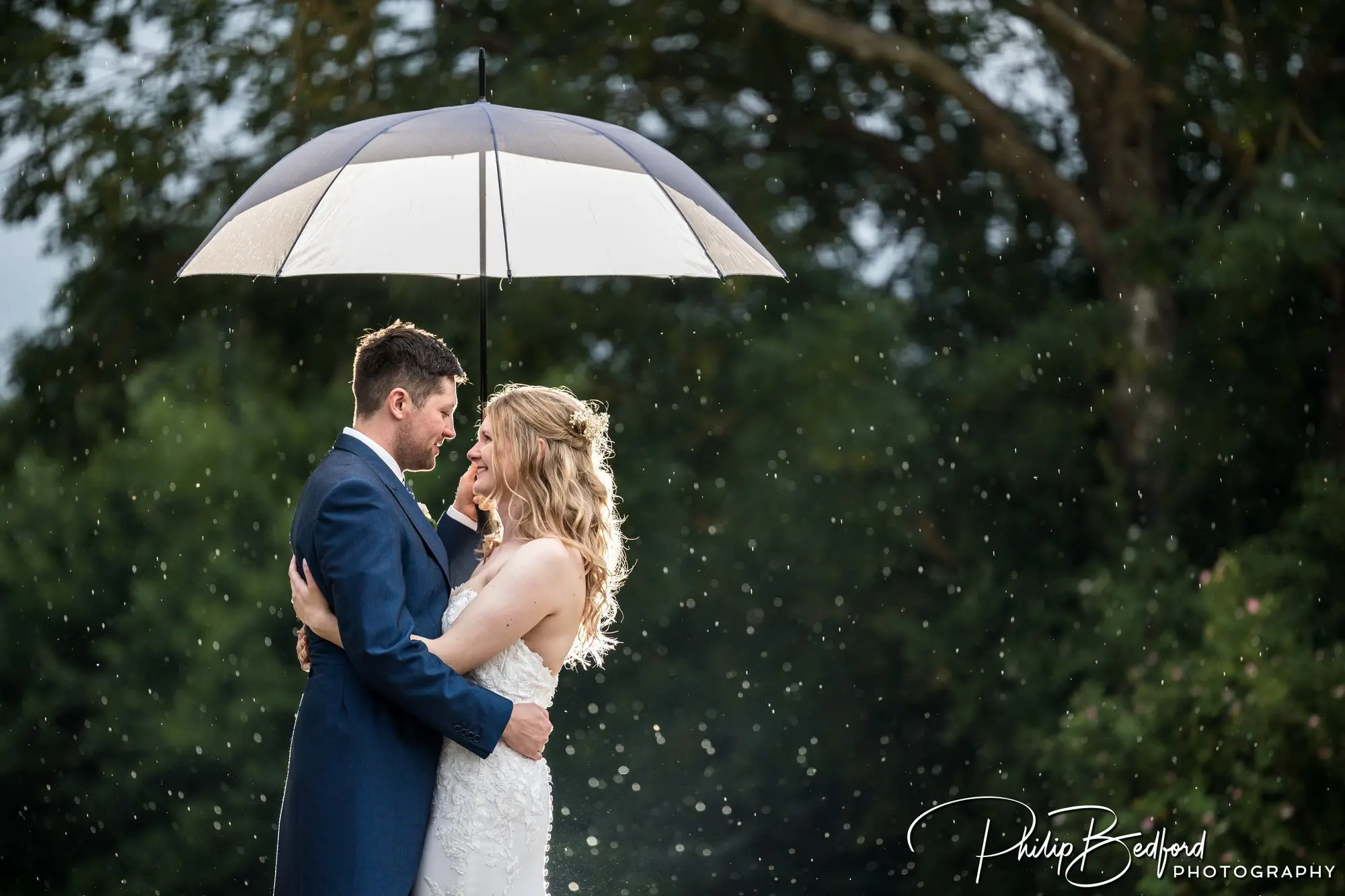 West Sussex Wedding Bride & Groom in the rain.